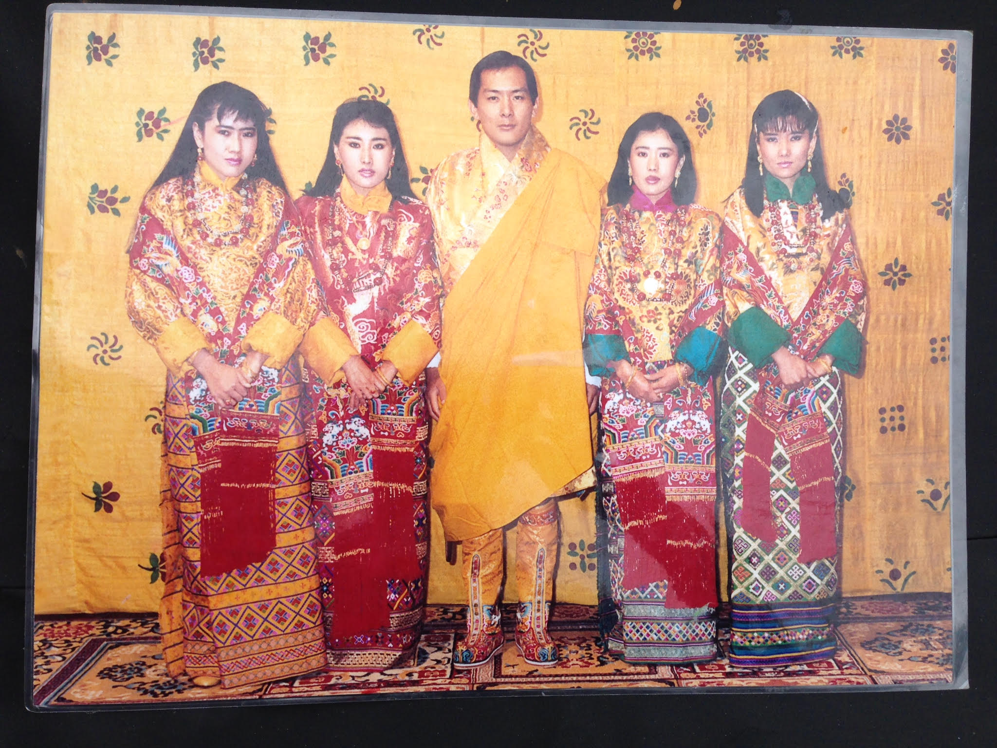 The retired king of Bhutan with his four wives, all sisters